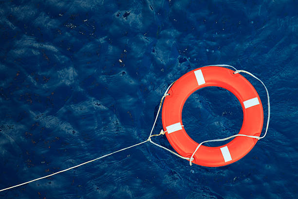 Lifebuoy in a stormy blue sea, safety equipment in boat